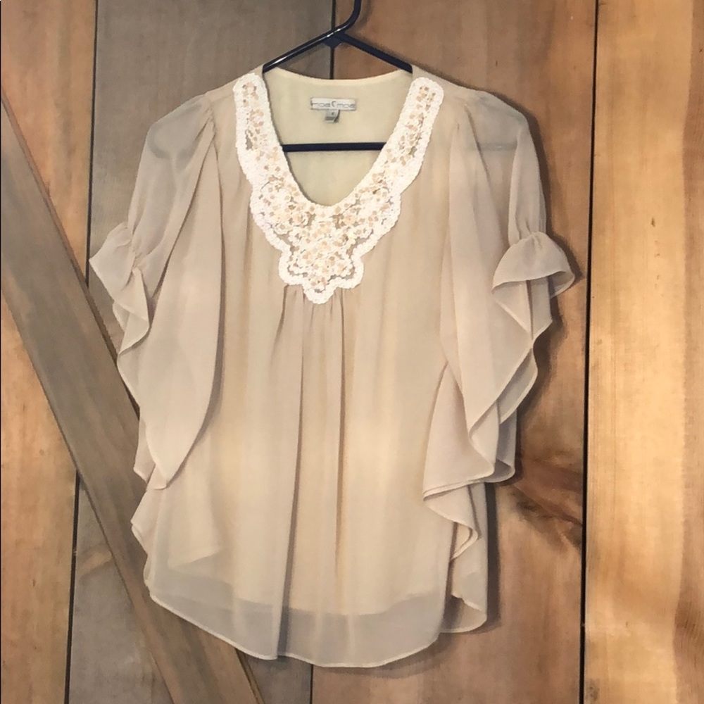 Tan blouse with embroidered neckline